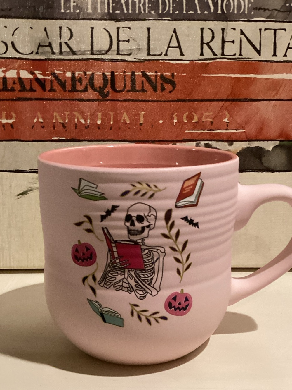 Pink Skeleton Reading a Book Halloween Mug